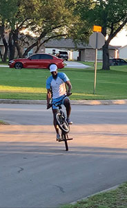Mahntie riding his bike after ankle surgery.