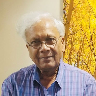 A headshot of patient, Dr. Raj Wilson, smiling.