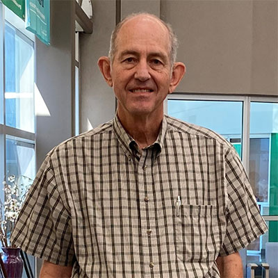 Herond Hoyt smiling after recovering from spinal surgery.