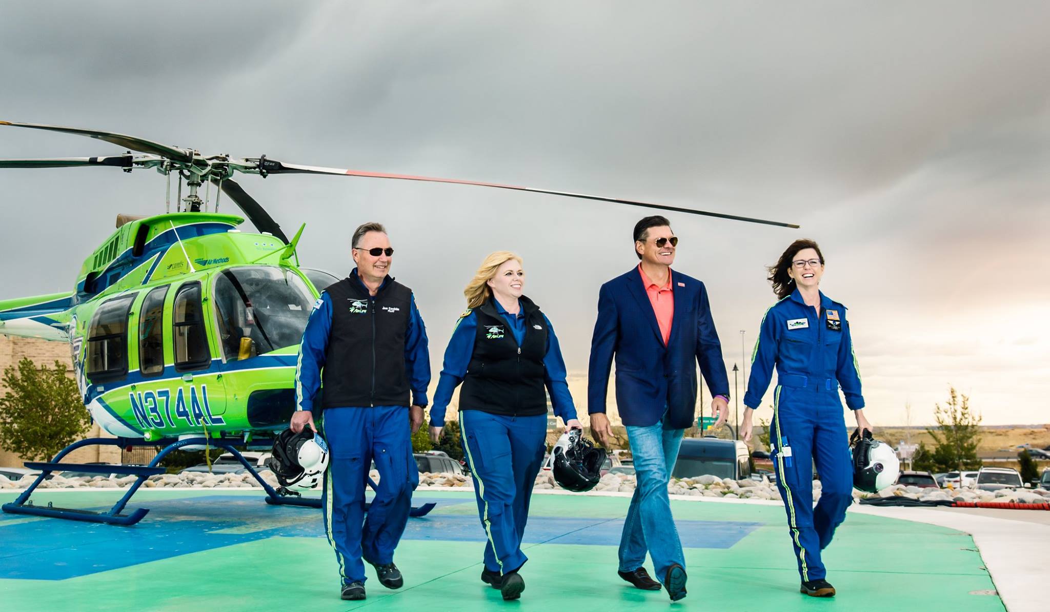Bill Meehan walking on a landing pad with the AirLife helicopter flight crew.