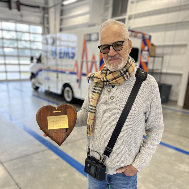 Photo of William Booth holding the heart with inscription for his caregivers.