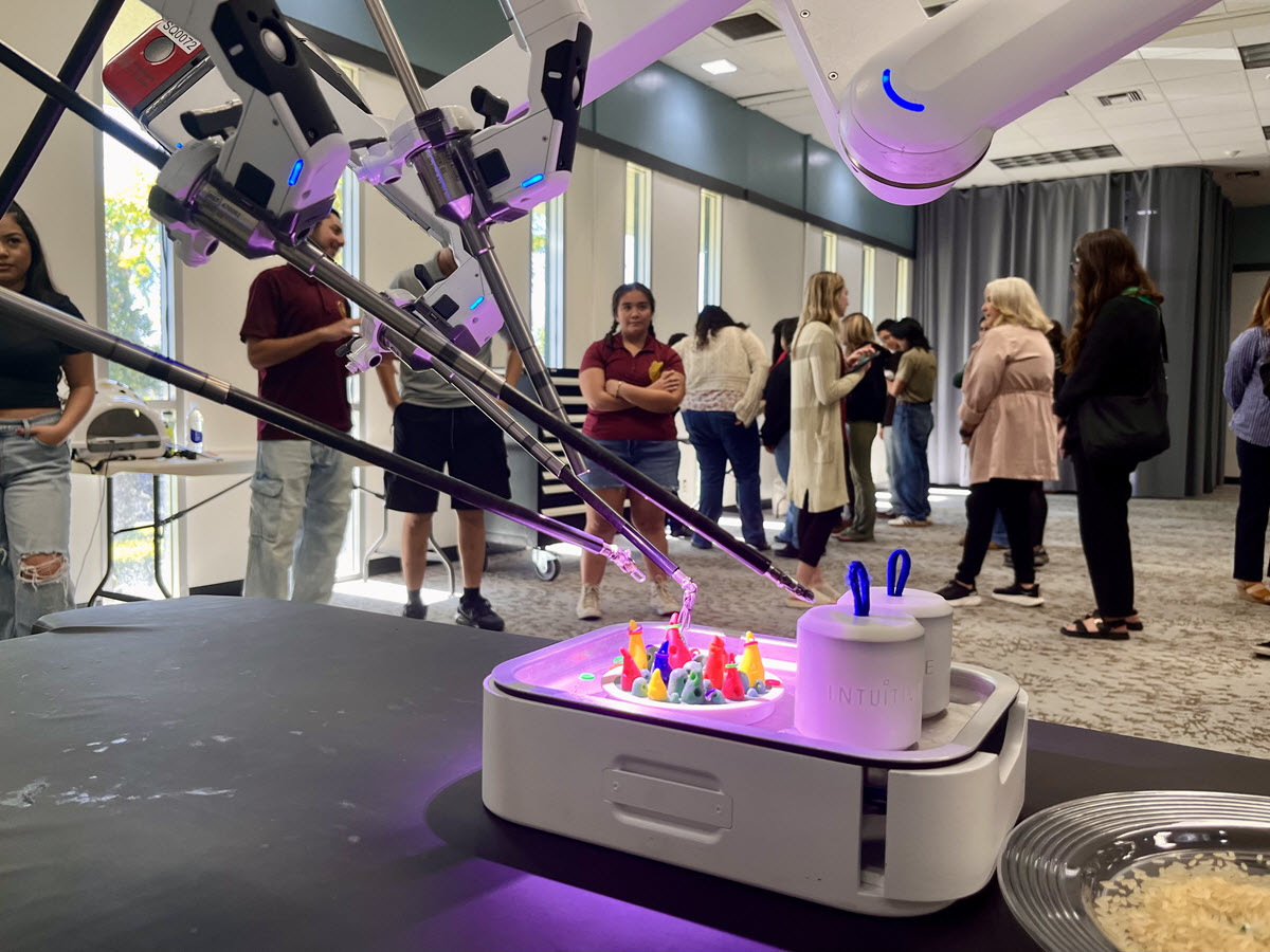 Students learning about the robot's capability.