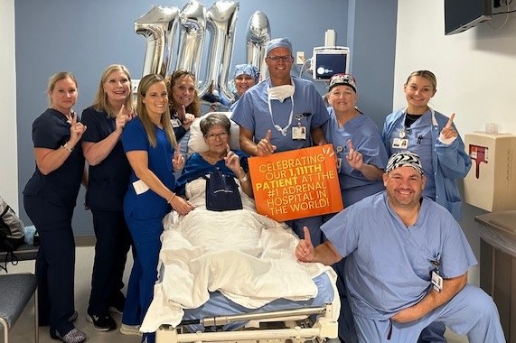 HCA employees pose with a patient.