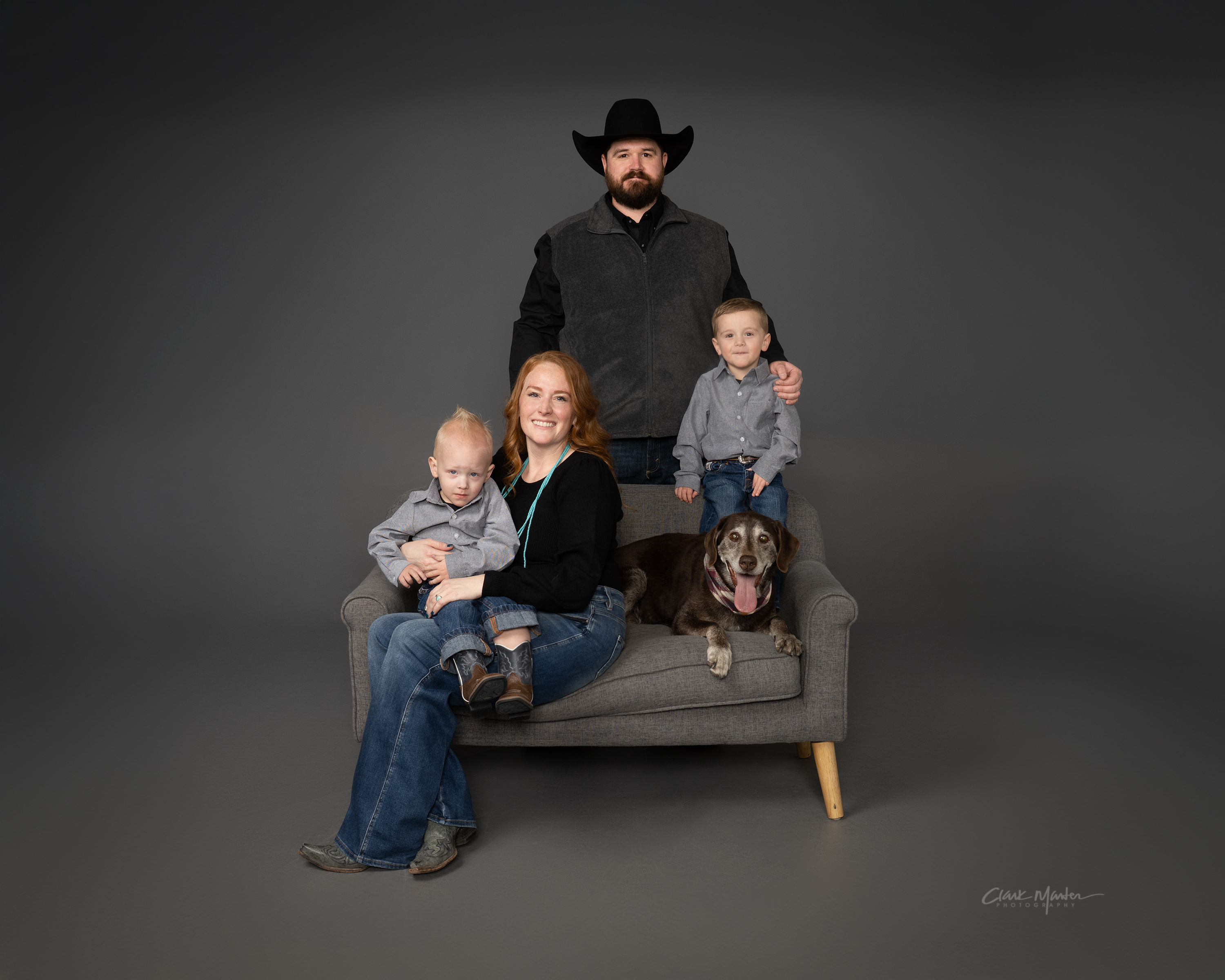 Cassie Pickrel sitting on a couch with her family