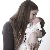 Monica holding baby Brooklynn.