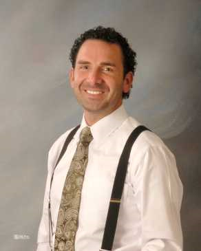 Chief Executive Officer of Memorial Health Meadows Hospital W. Wesley "Wes" Taylor smiling, wearing dress shirt and necktie.