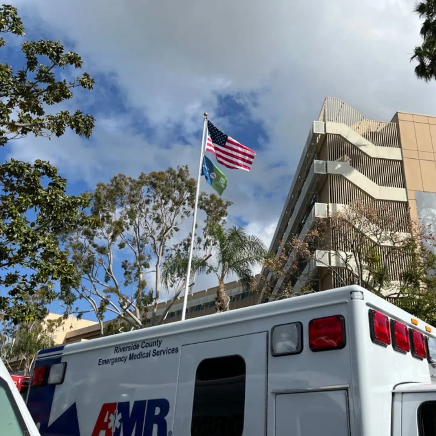 The top of an ambulance, looking at Riverside Community Hospital.