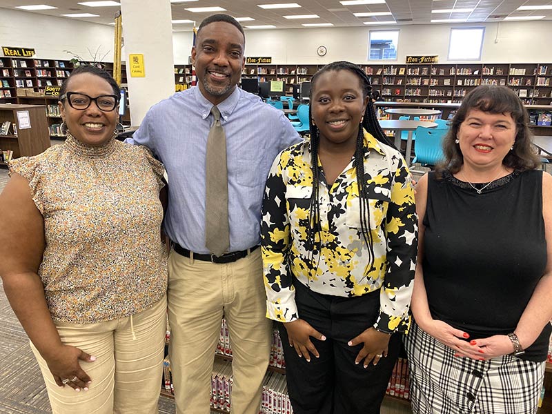 4 volunteers at the Goose Creek school supplies drive.