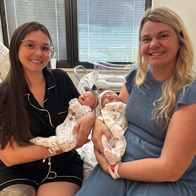 Heather (left) and Kayla's babies meet for the first time.