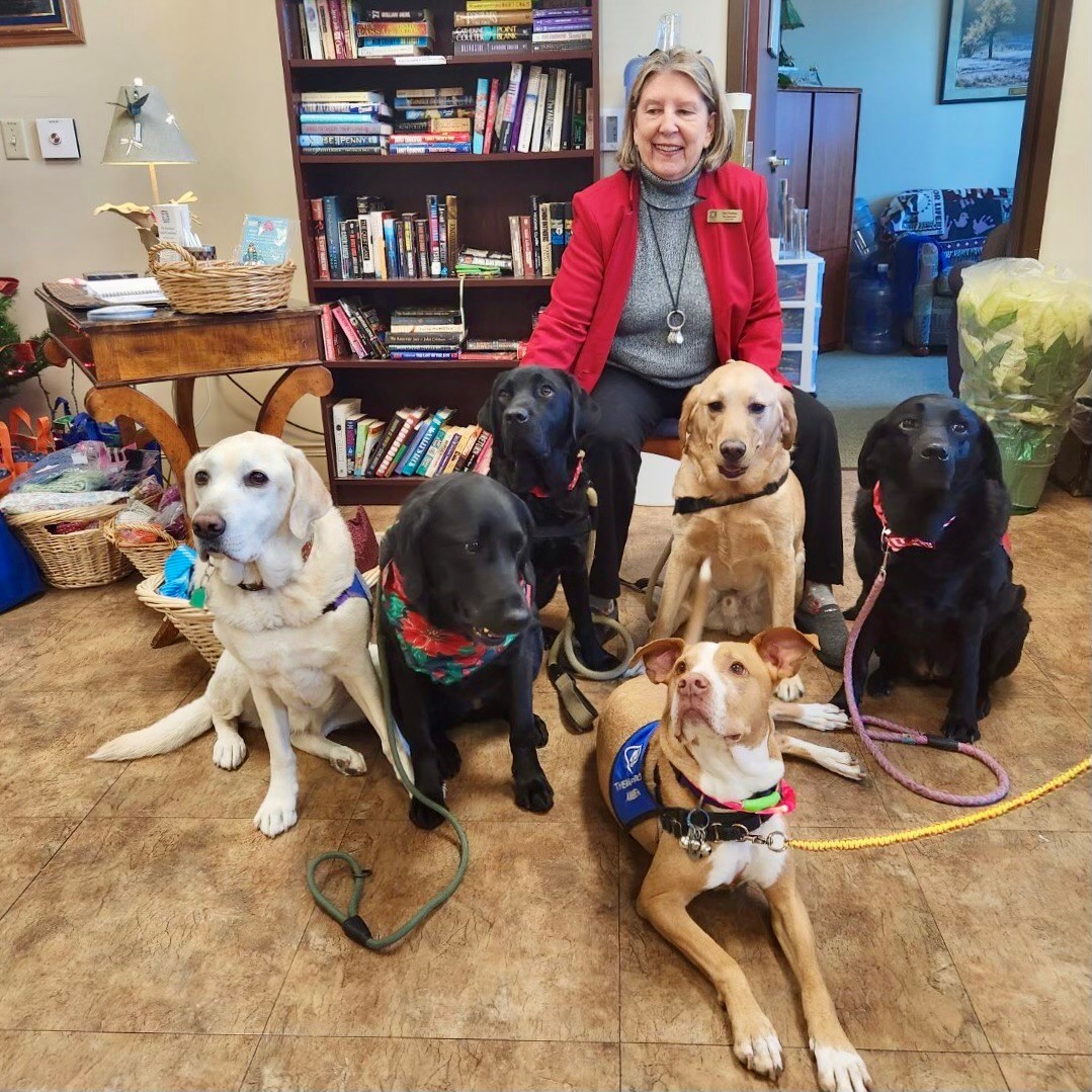 Pat Phillips, who volunteers at Johnston-Willis Hospital, with the Monday canine therapy team. 