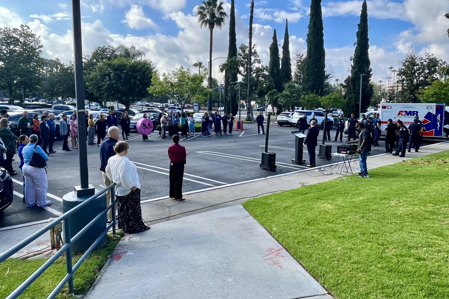 Riverside Community Hospital colleagues, EMS and Fire department teams gather around during the Donate Life ceremony.