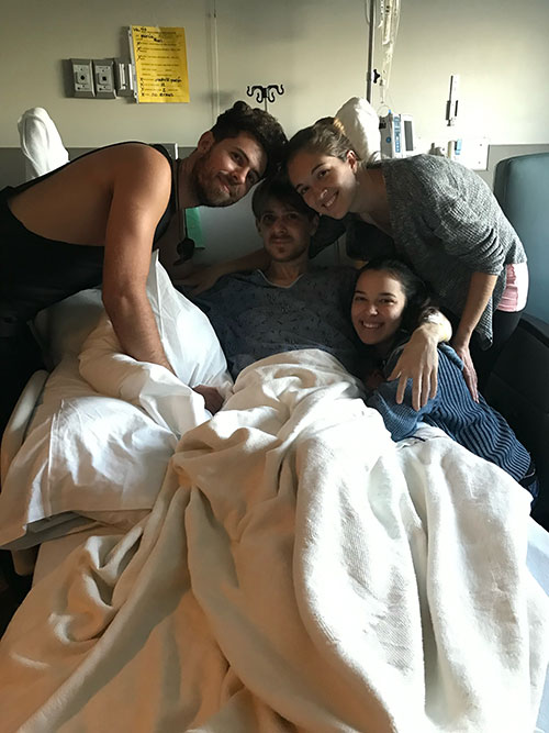 Noah smiles while surrounded by family during his stay at Research Medical Center.