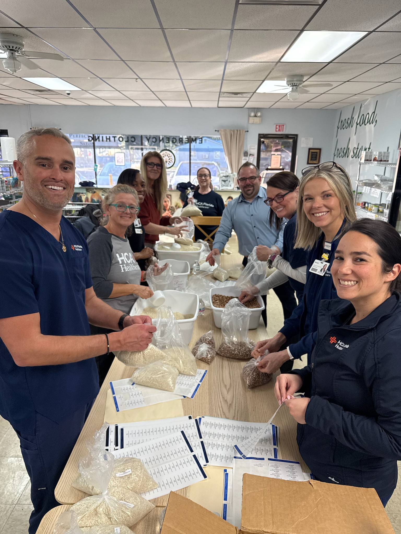 HCA leaders bagging beans and rice for ECHO of Brandon.