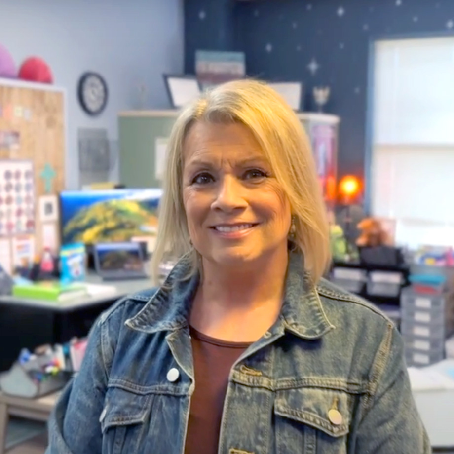 Cindi Spradlin, recovered from her heart transplant, posing for video in the classroom where she teaches.