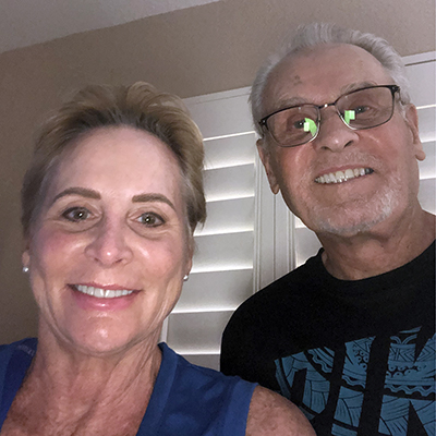 Married couple Barbara Shriber and Ed Shriber smiling. 