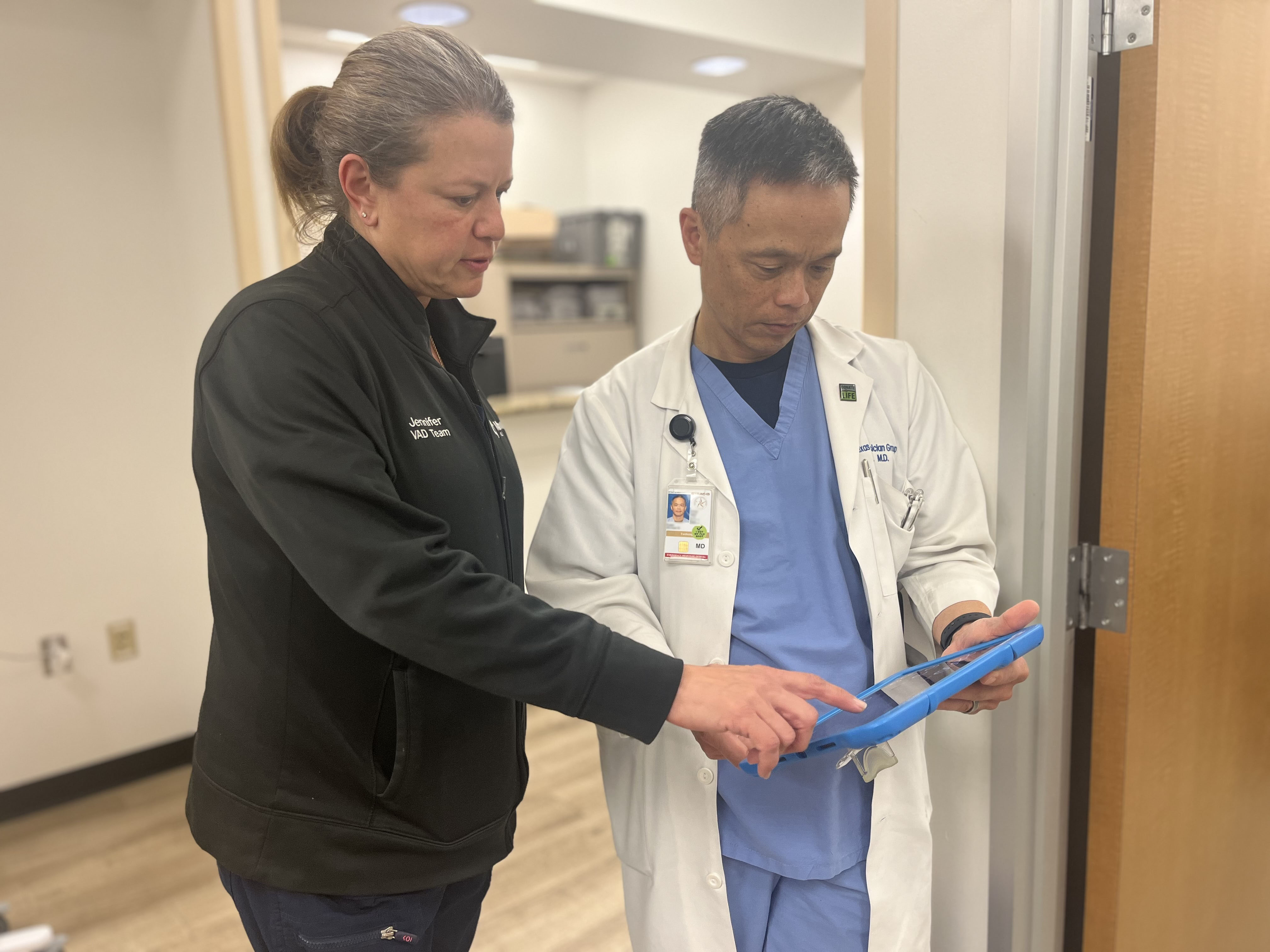 Dr. Kwan, transplant cardiologist, reviews patient chart.