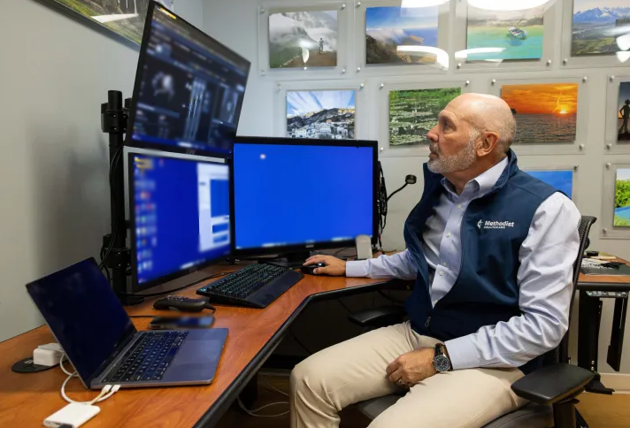 Dr. Michael Lane sitting at a desk using the AI tool