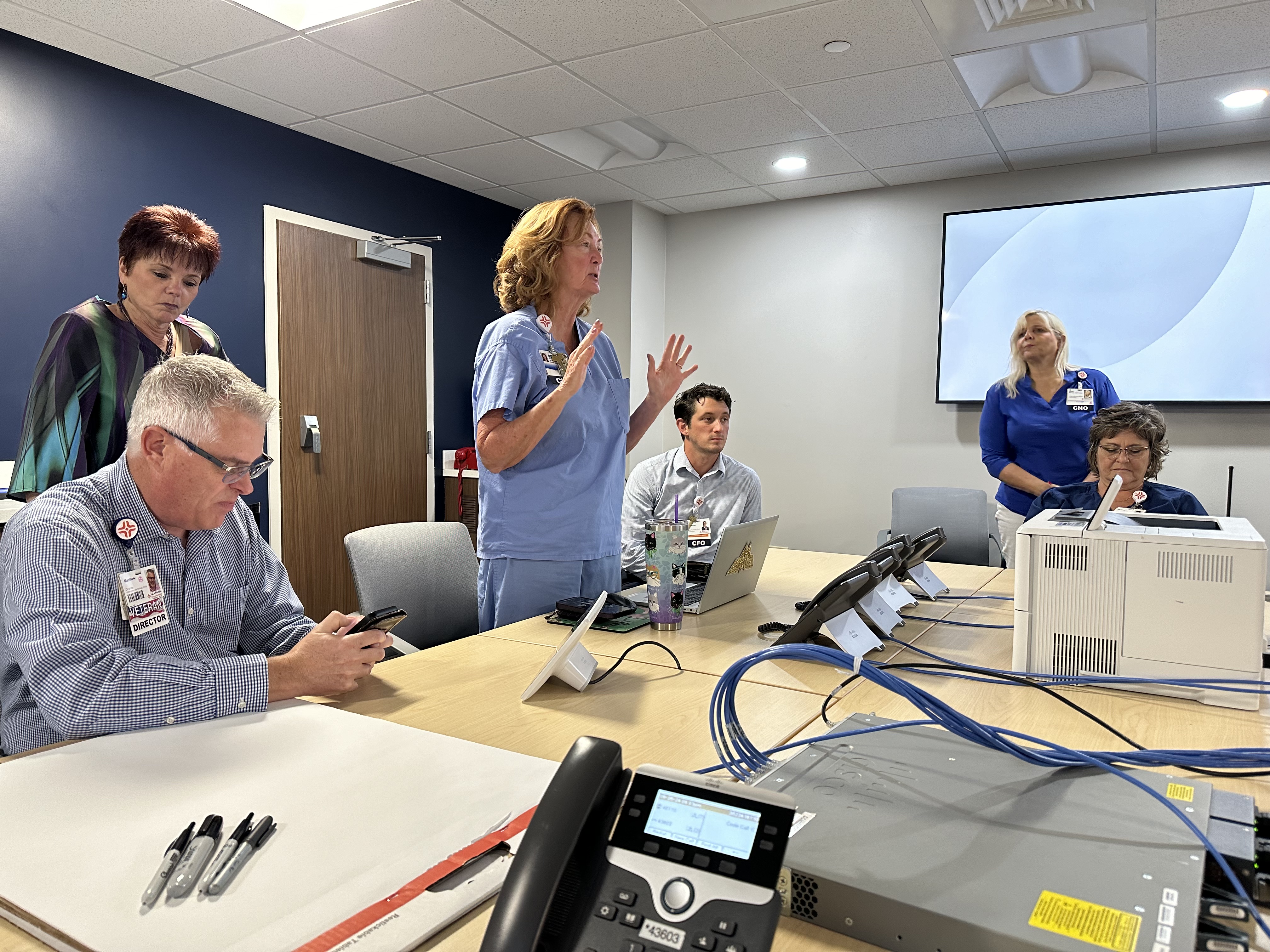 Lisa Nummi, CEO of Citrus Hospital speaks with the team.