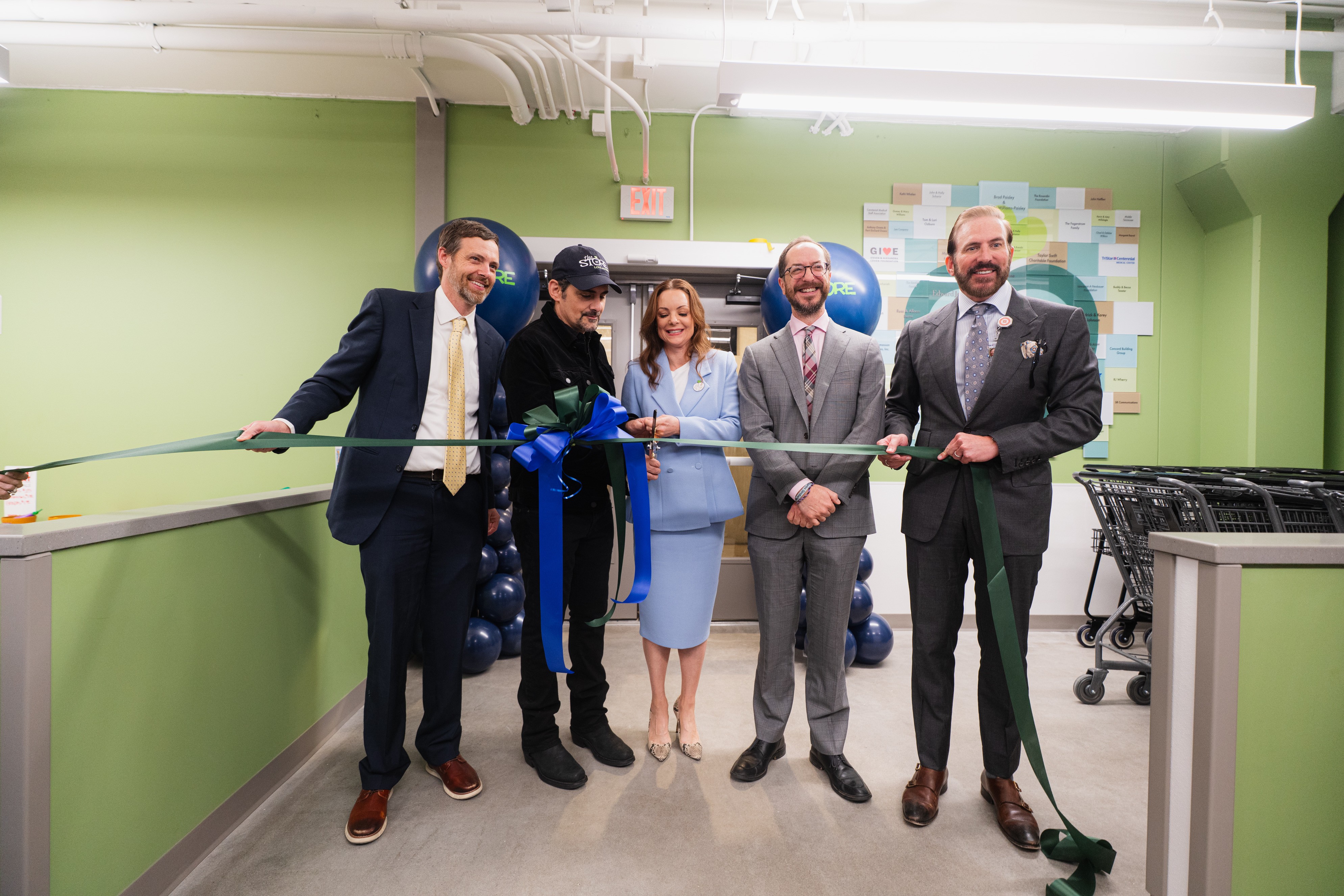 The Store CEO Collen Mayer, Brad Pasiley, Kimberly Pasiley Williams and TriStar Centennial CEO Tom Ozburn prepare to cut the ribbon.