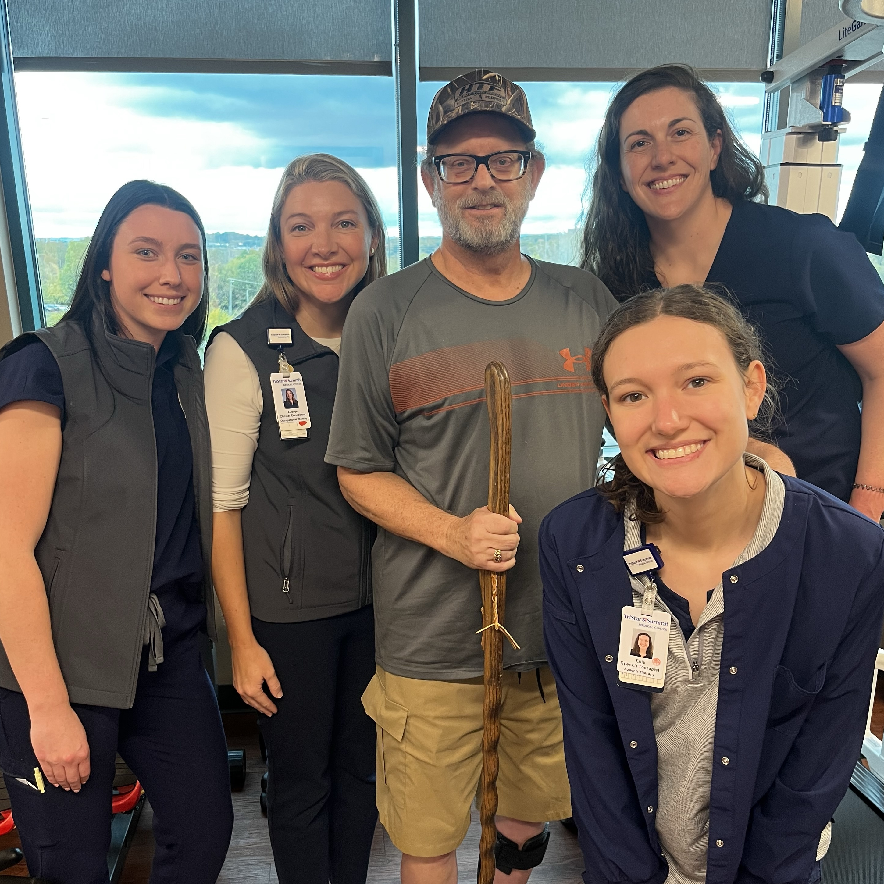 Group of people (Wayne Hackett and TriStar Summit Medical Center team) smiling and posing for a picture.