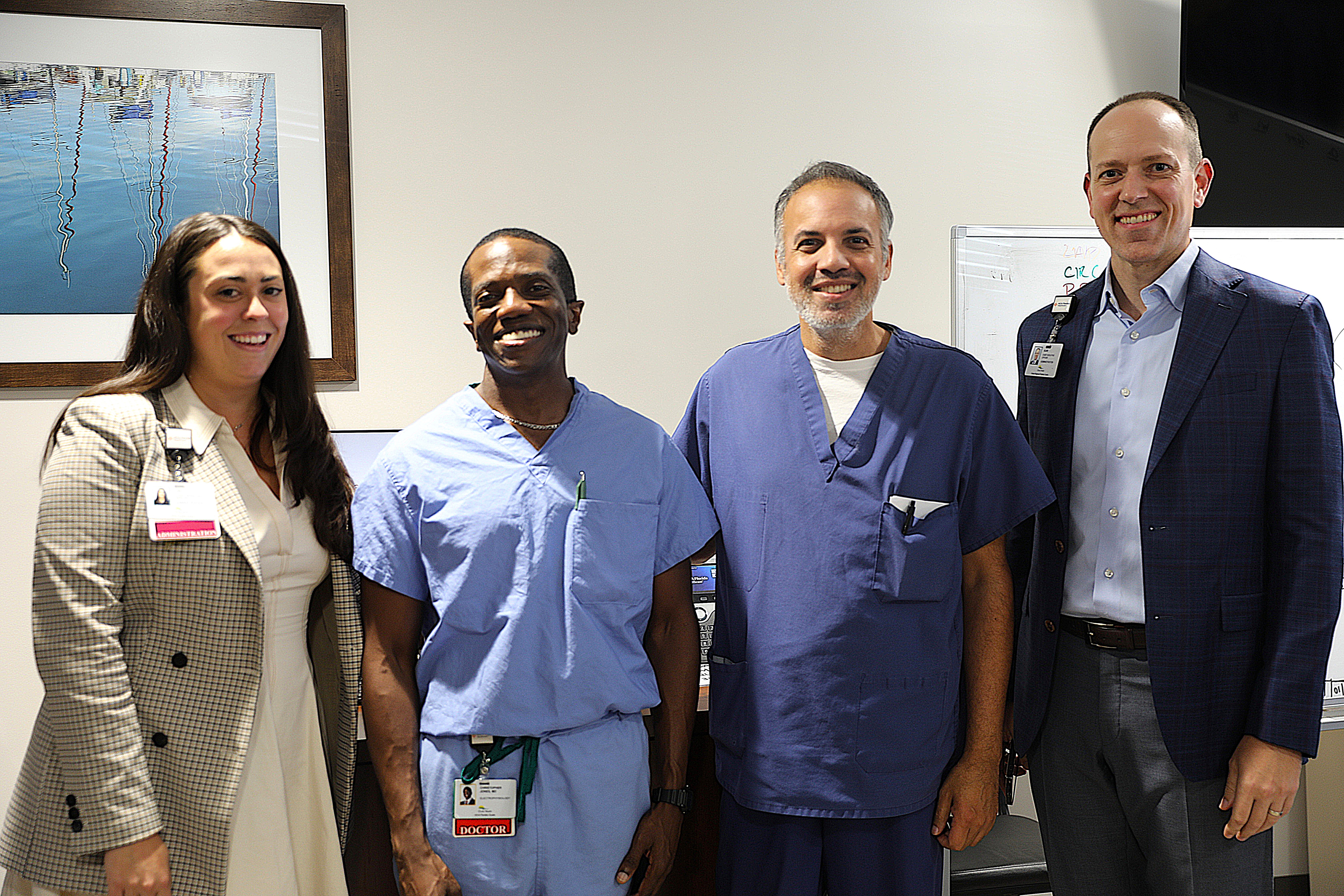 Physicians smile with HCA Florida Ocala Hospital administrators.