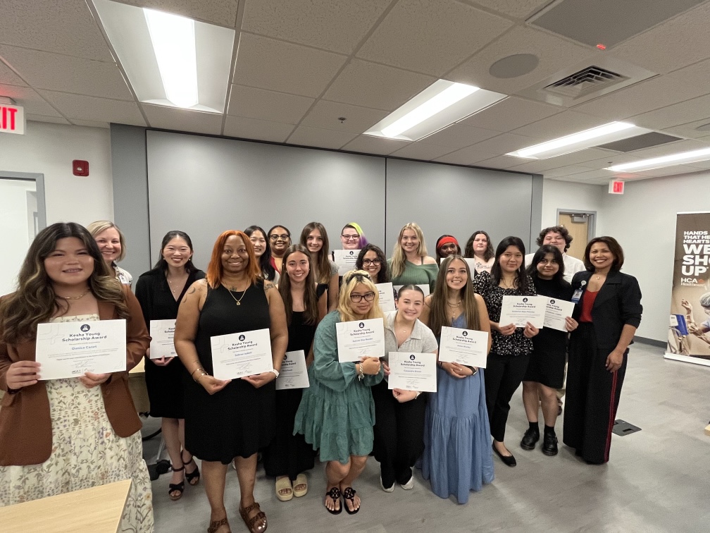 Group of students from across Western North Carolina holding the annual Kesha Young Health Careers Scholarship certificates.