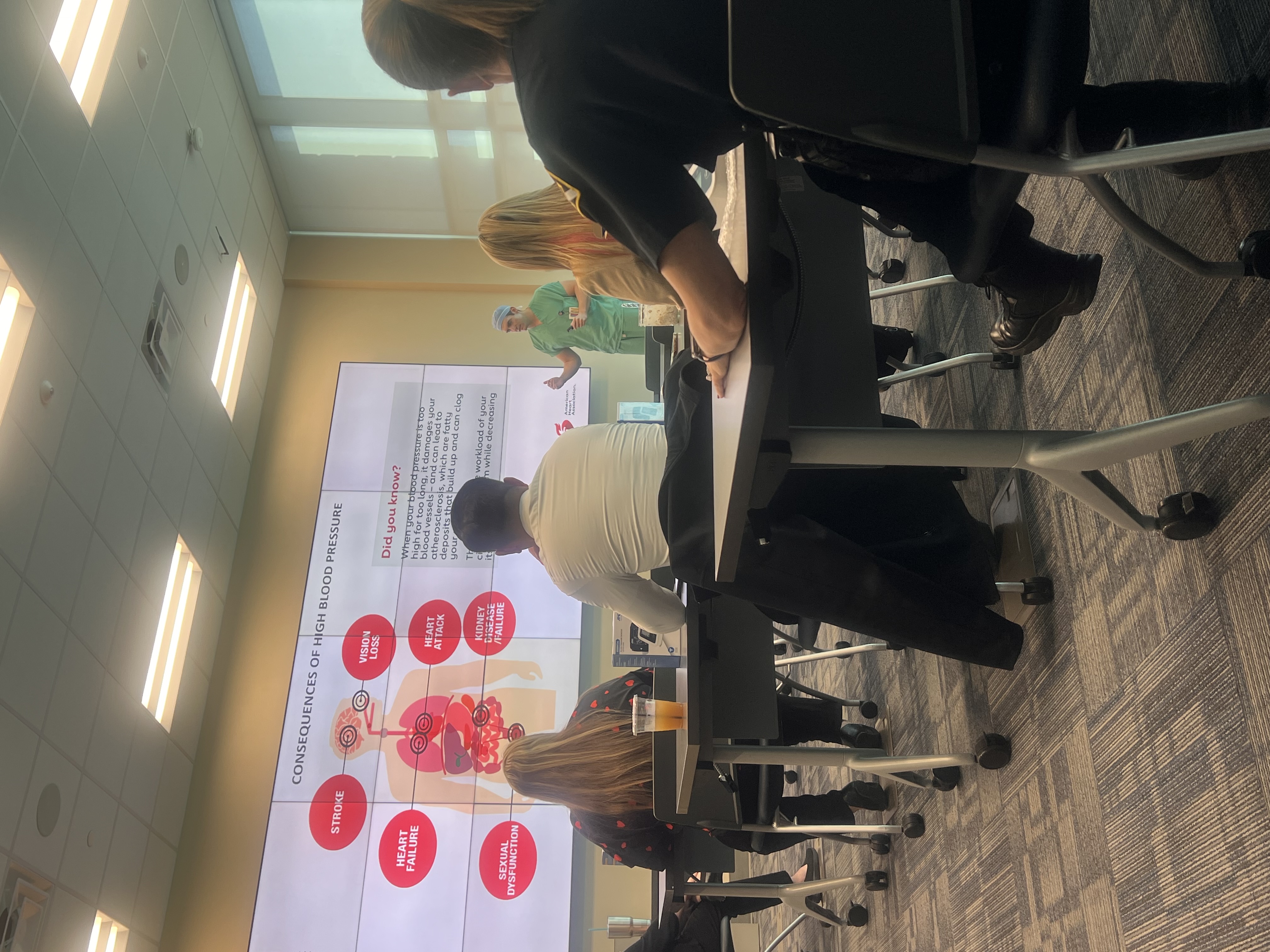 Photo showing of St. Pete local officers (partnering with the American Heart Association) having a lifesaving education class.