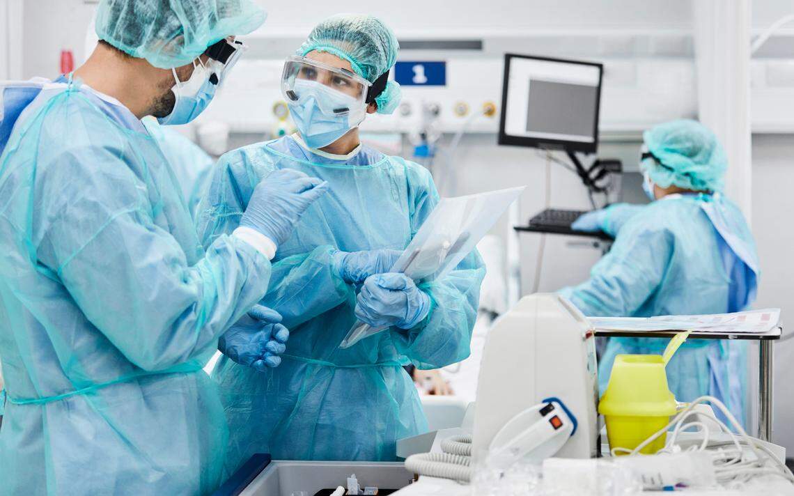 Surgeons discussing the details of an upcoming surgery.