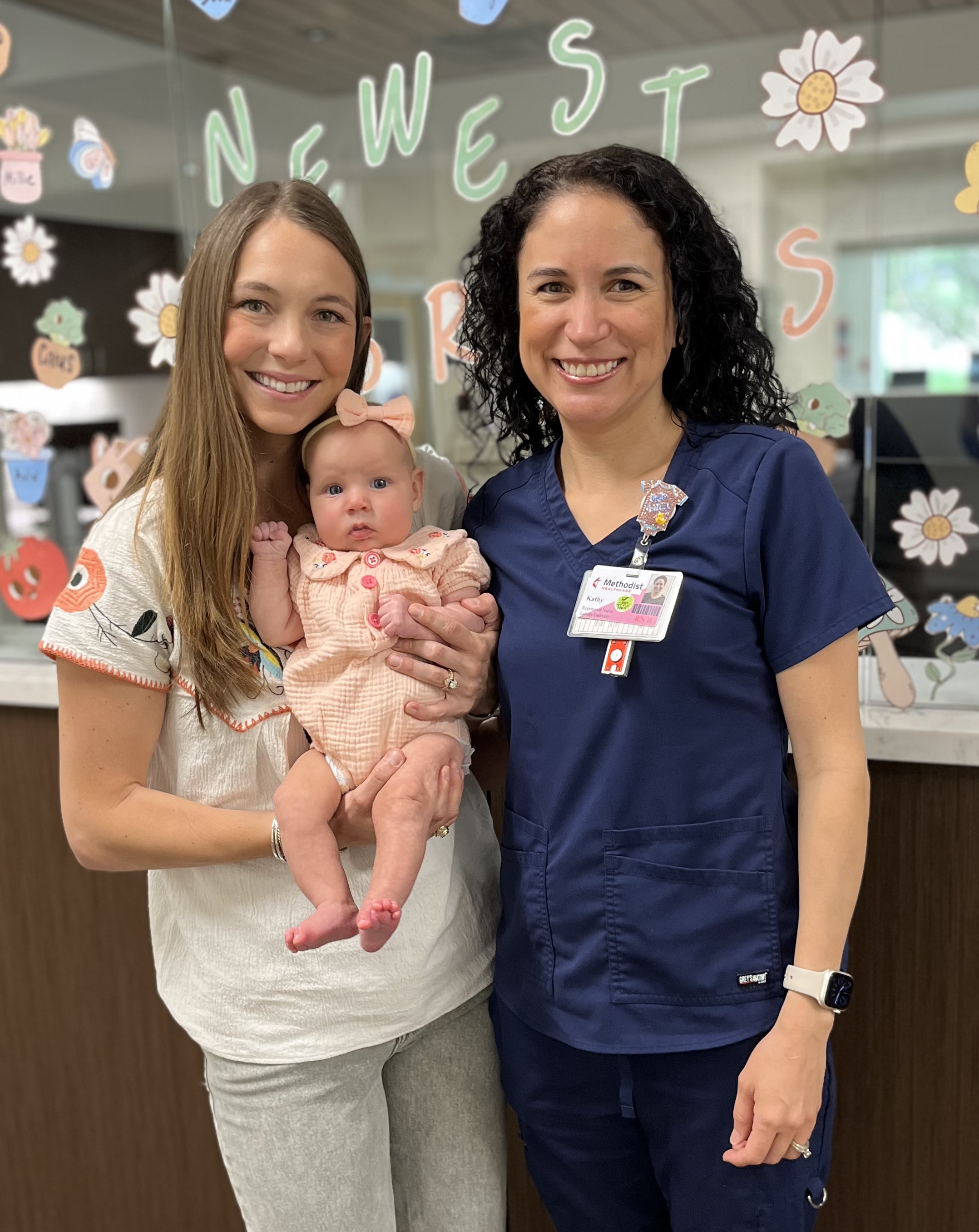 Lainey Bourgeois Riebesehl with her baby and her physician Dr. Stafford.