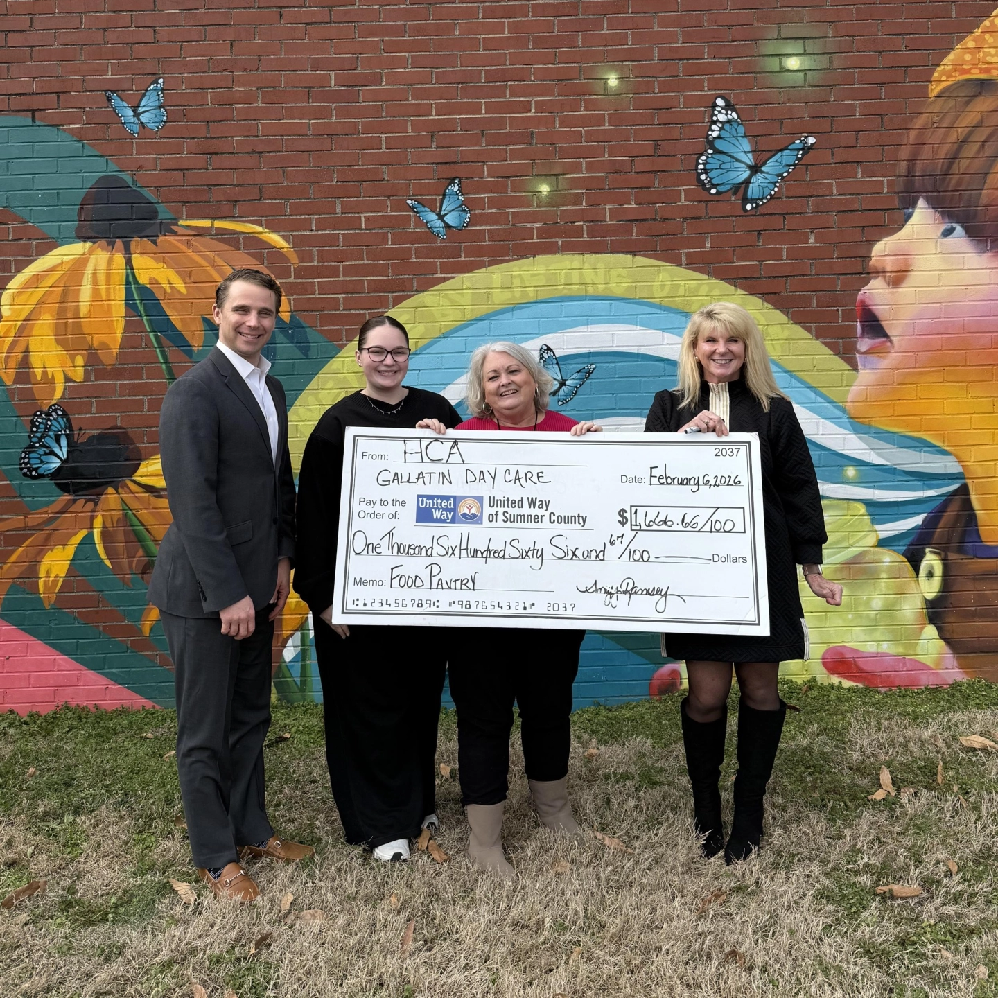 HCA team members present donation to Gallatin Day Care.