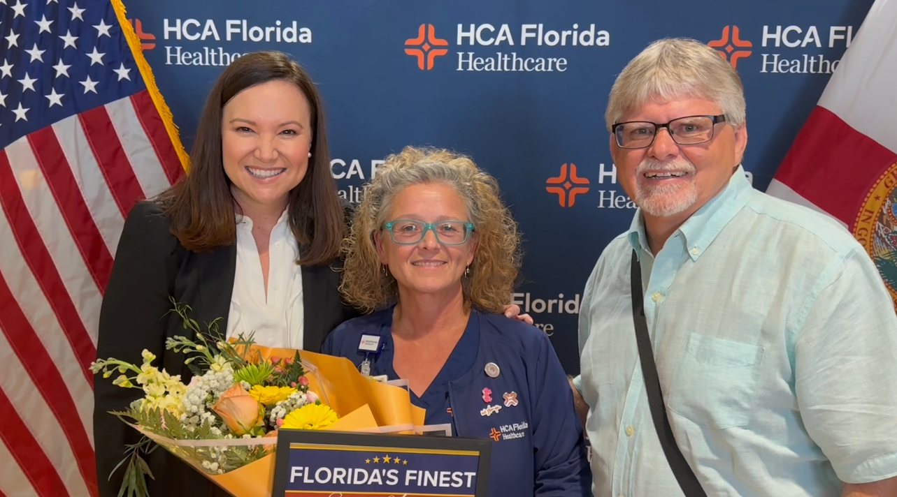 Nurse Sharon Gibbs stands with Sen. Ashley Moody and patient, Jeff Pollier, after providing life-saving CPR to Jeff months earlier.