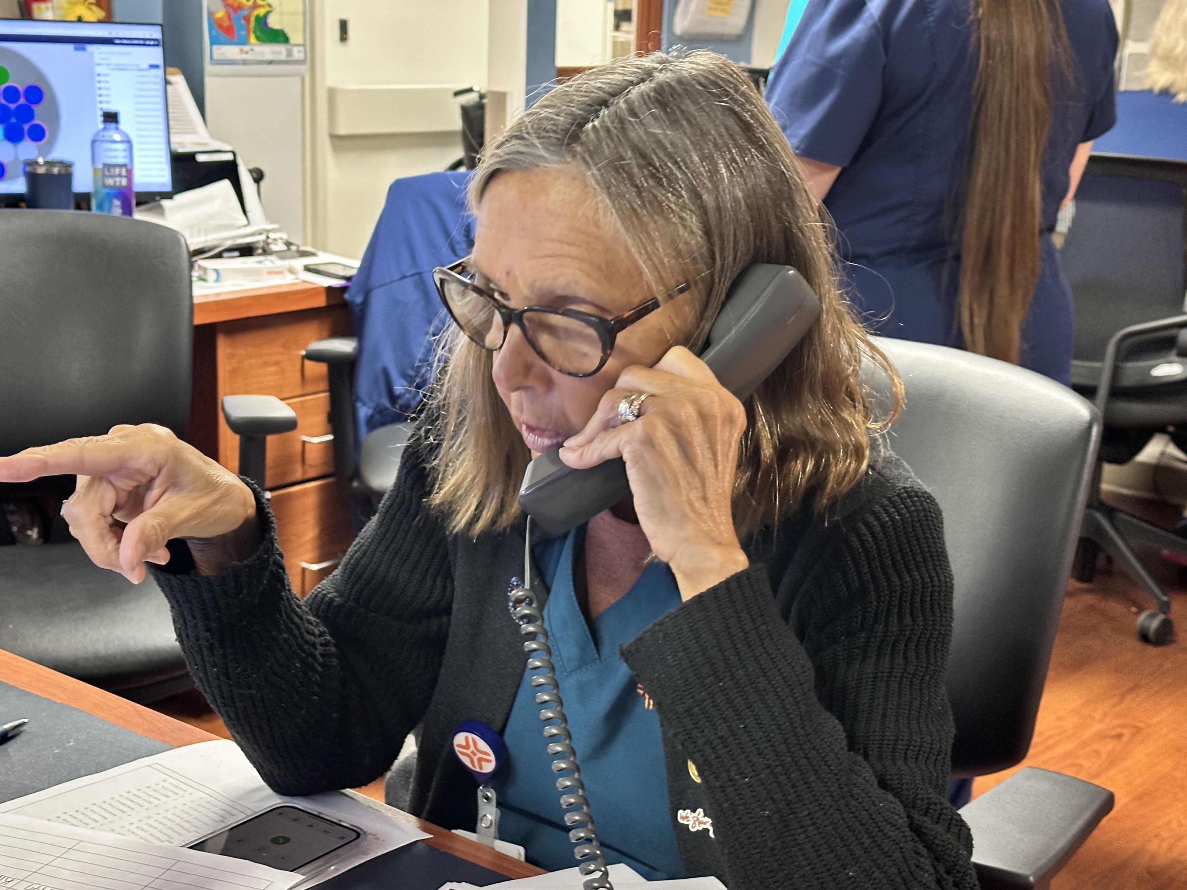 Englewood employee taking phone call.