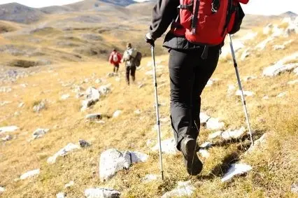 a group of people hiking on a rocky mountainside