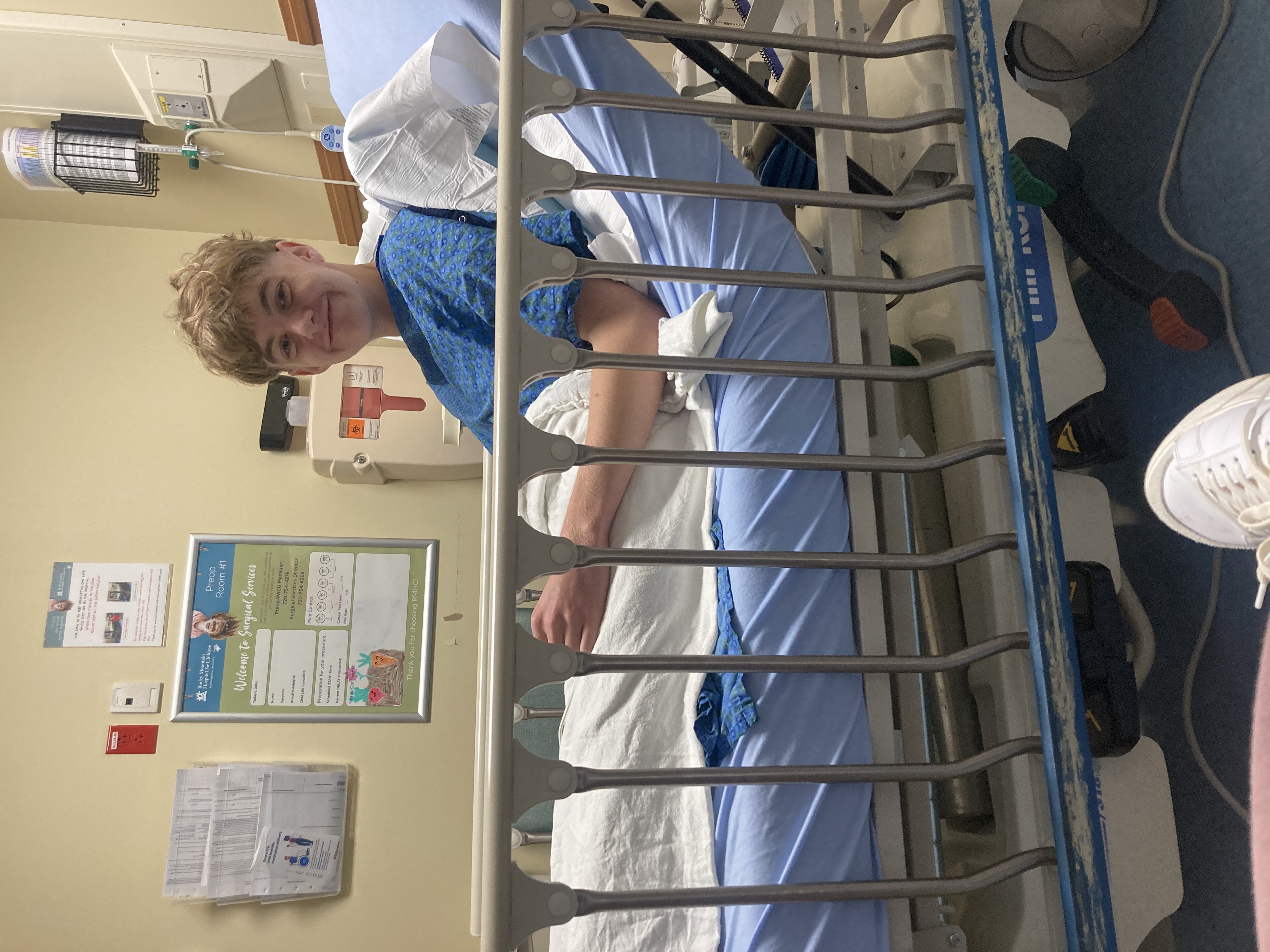 Reven smiling after surgery in his hospital bed.