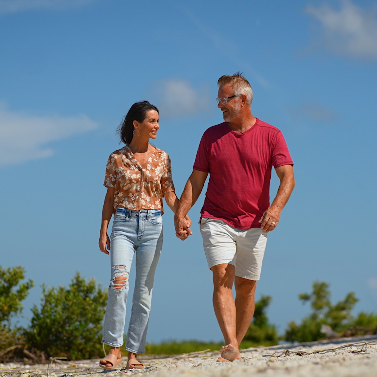 Scott Larsen and wife walking hand in hand.