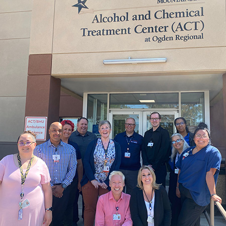 ACT Team posing outside of the ACT facility.