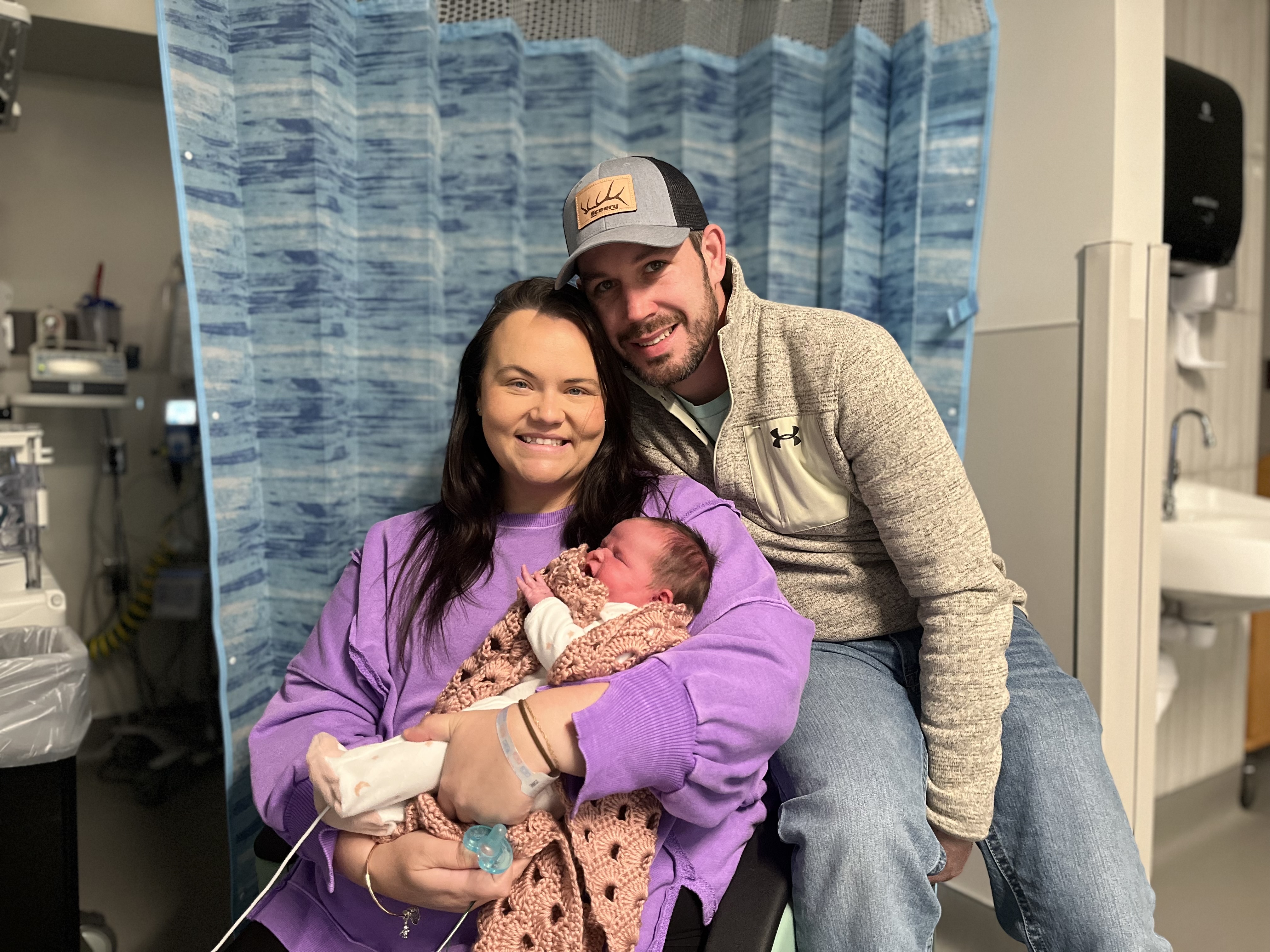 Mandy and her husband pose with their newborn Harper Grace at LewisGale Medical Center. 