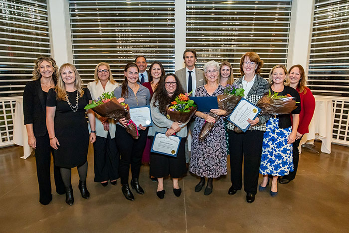 Mary Noble, or Frisbie Memorial Hospital, Ethel Hoffman, Marybeth Savage, and Mary McDonough, of Portsmouth Regional Hospital, surrounded by colleagues.