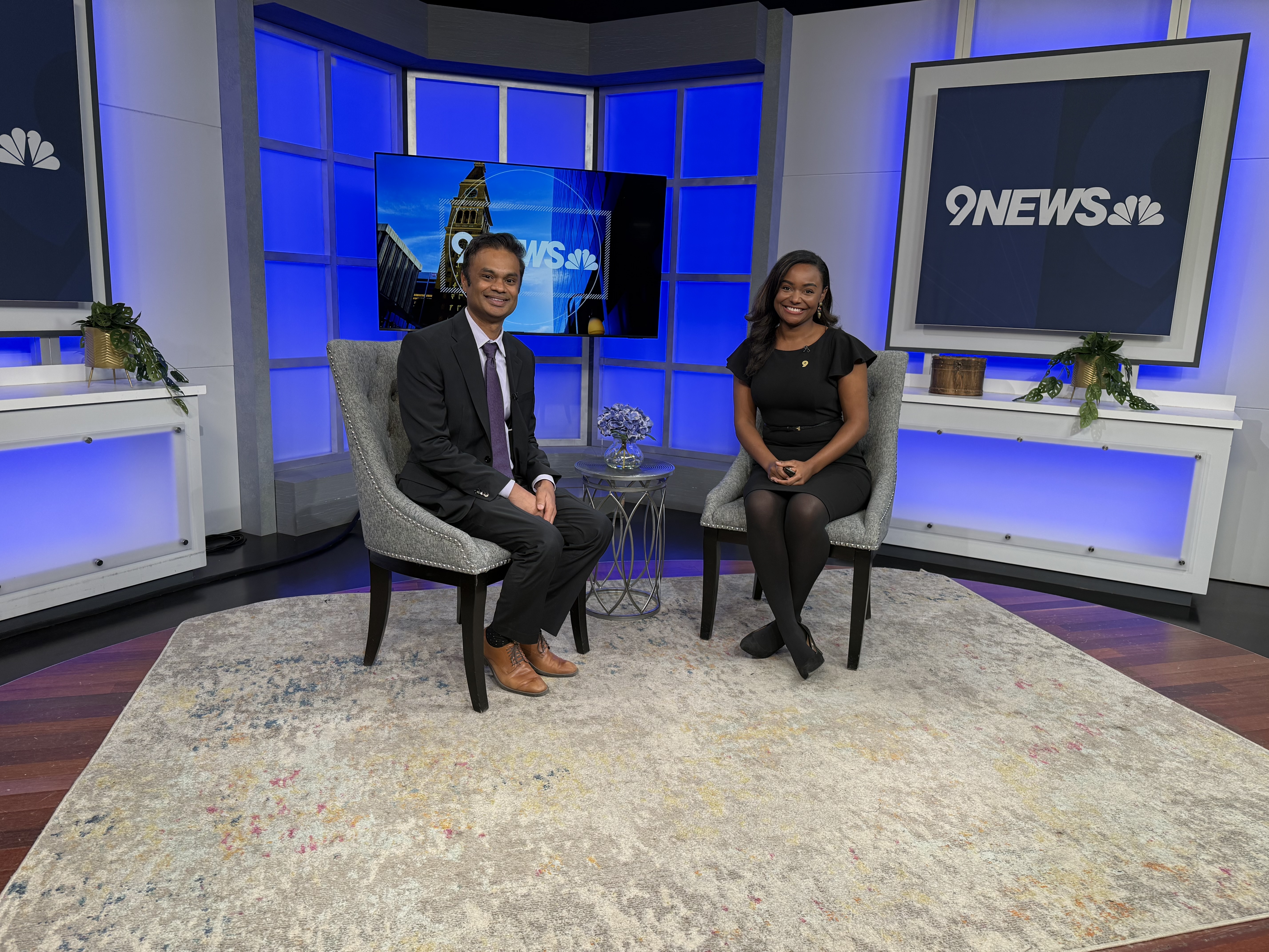Dr. Bupathi on the set of 9News with the host.