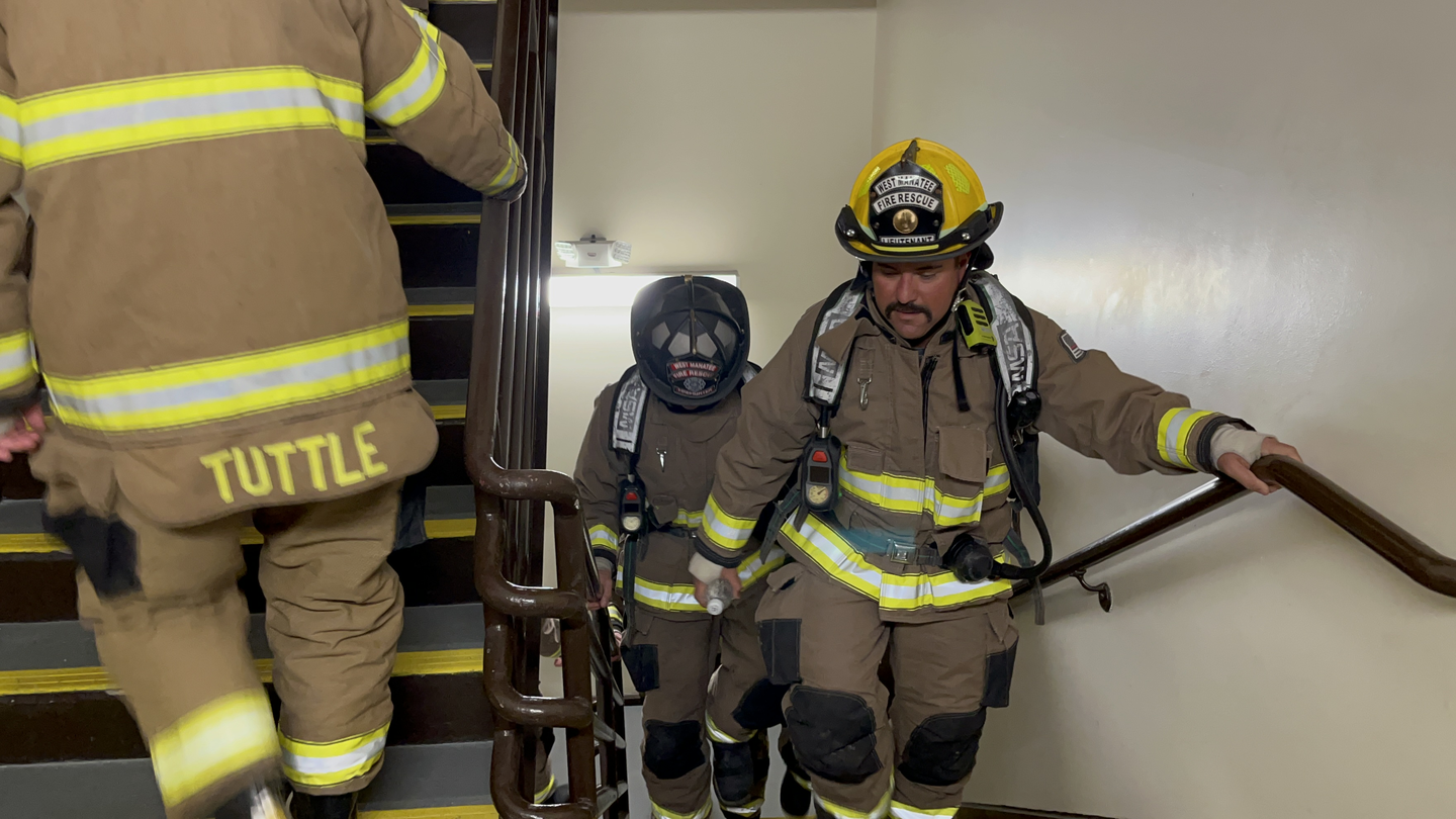 Local firefighters climbing tha stairs at Blake Hospital.