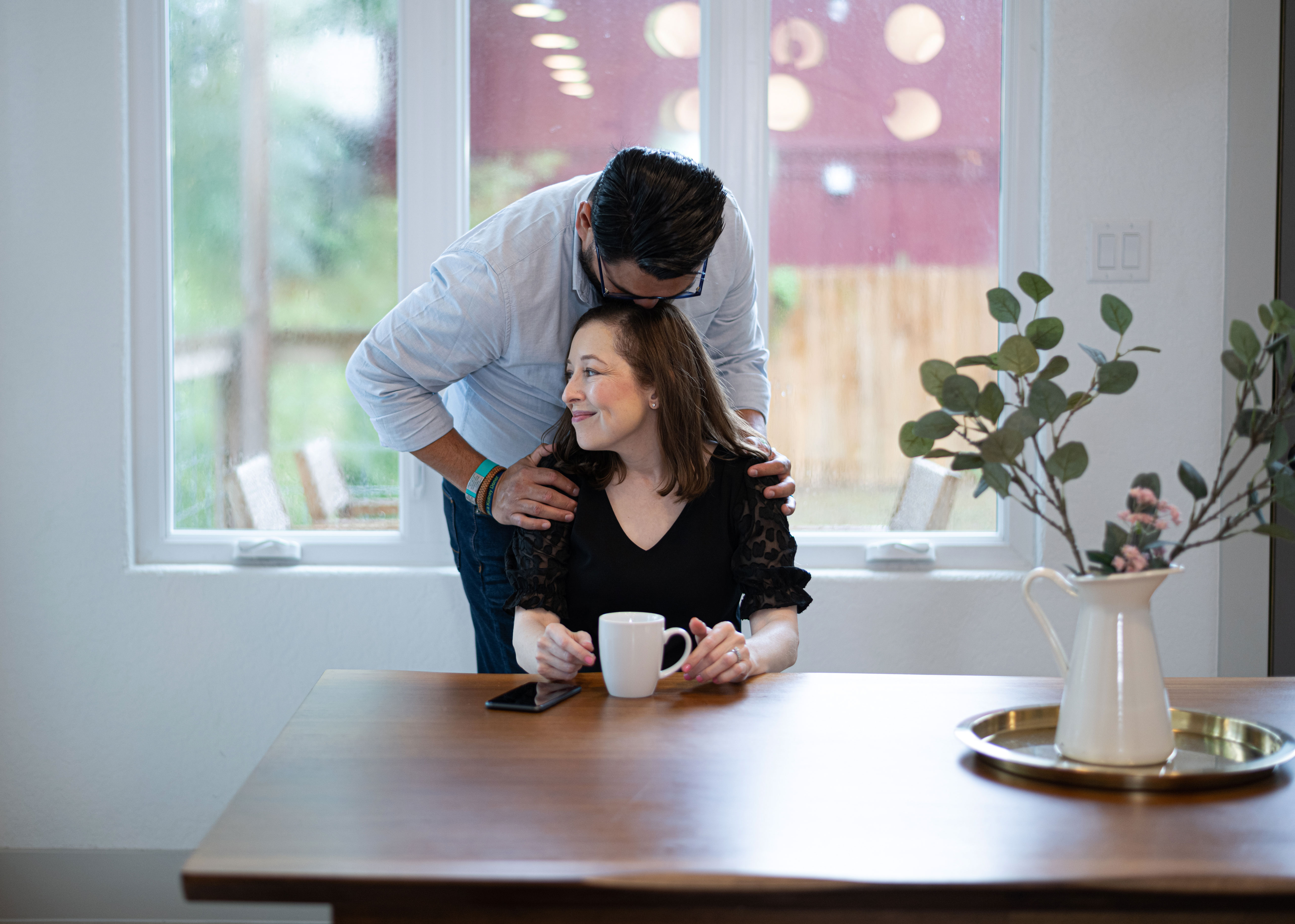 Michelle and Sal Gonzalez share a loving moment in their home.