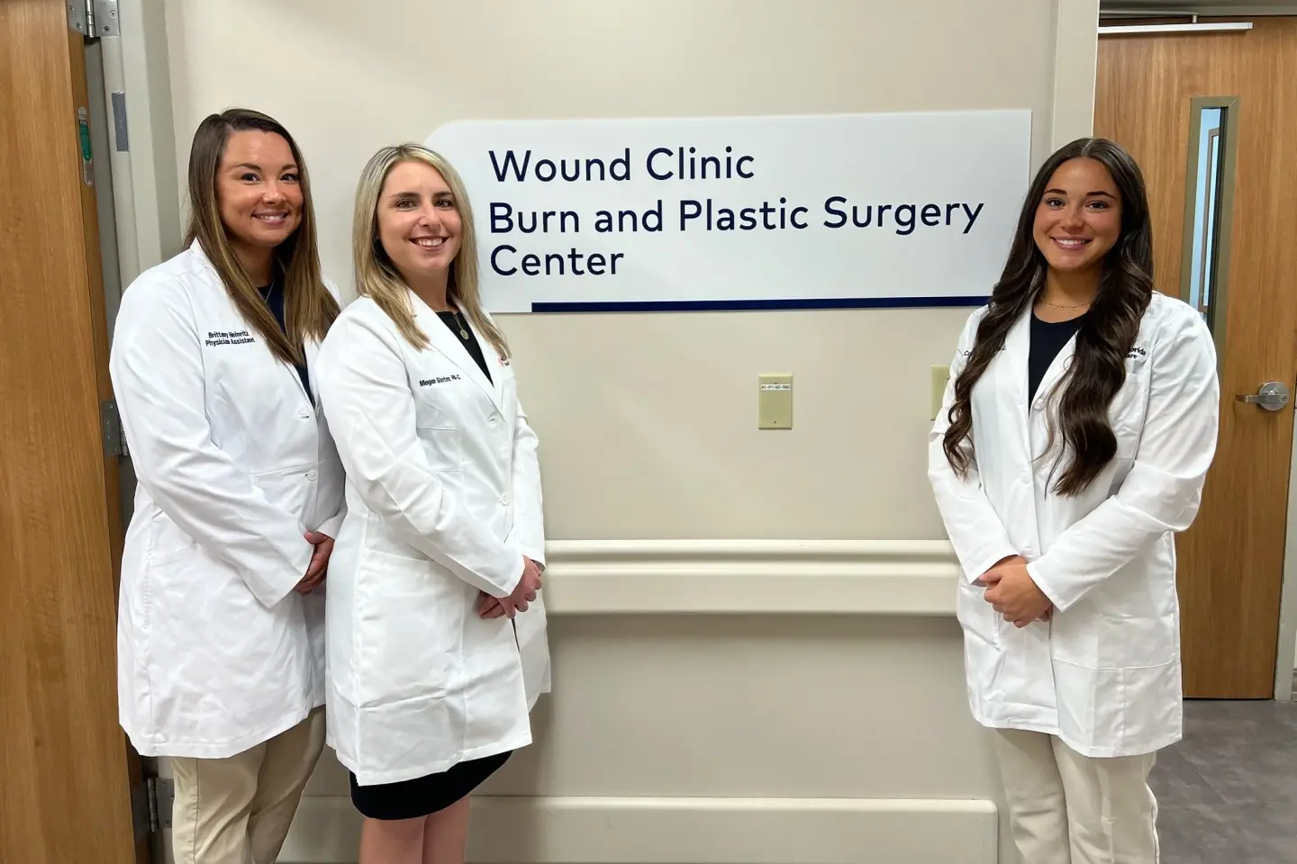 Wound Clinic team gathers into of entry at HCA Florida Brandon Hospital.