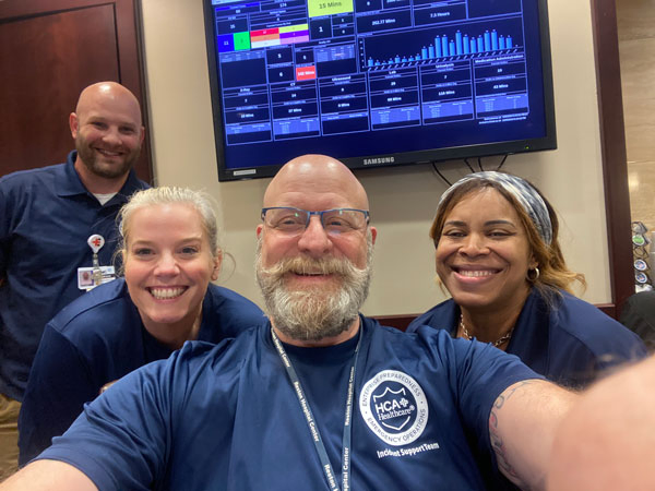 Andrew Johnson, Angela Giegerich, Keith Morrison, and Danielle Foster smile for the camera.