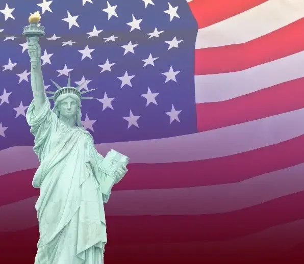 The Statue of Liberty with an American flag background.