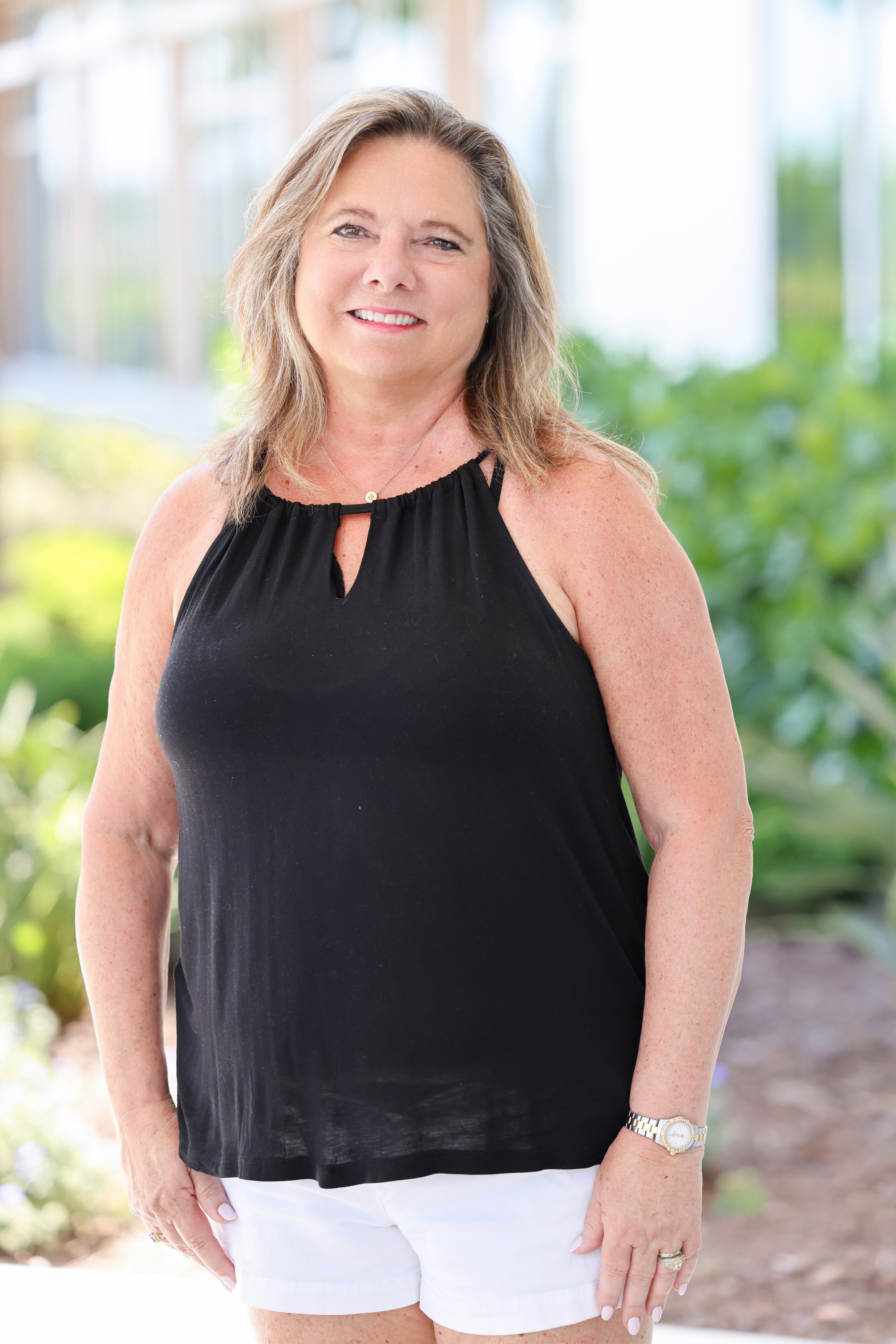 Patty Sedlmeier stands smiling 