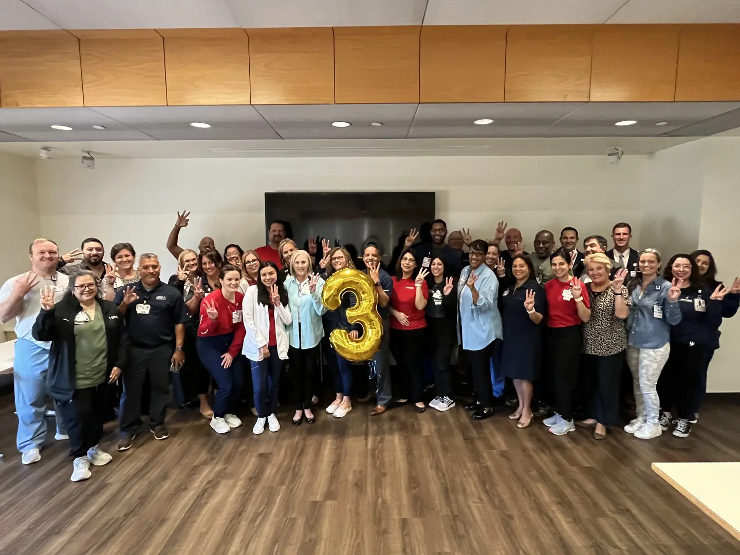 Methodist Hospital | Stone Oak Team Poses with Number 3 Balloon to Celebrate Recent Accolade.