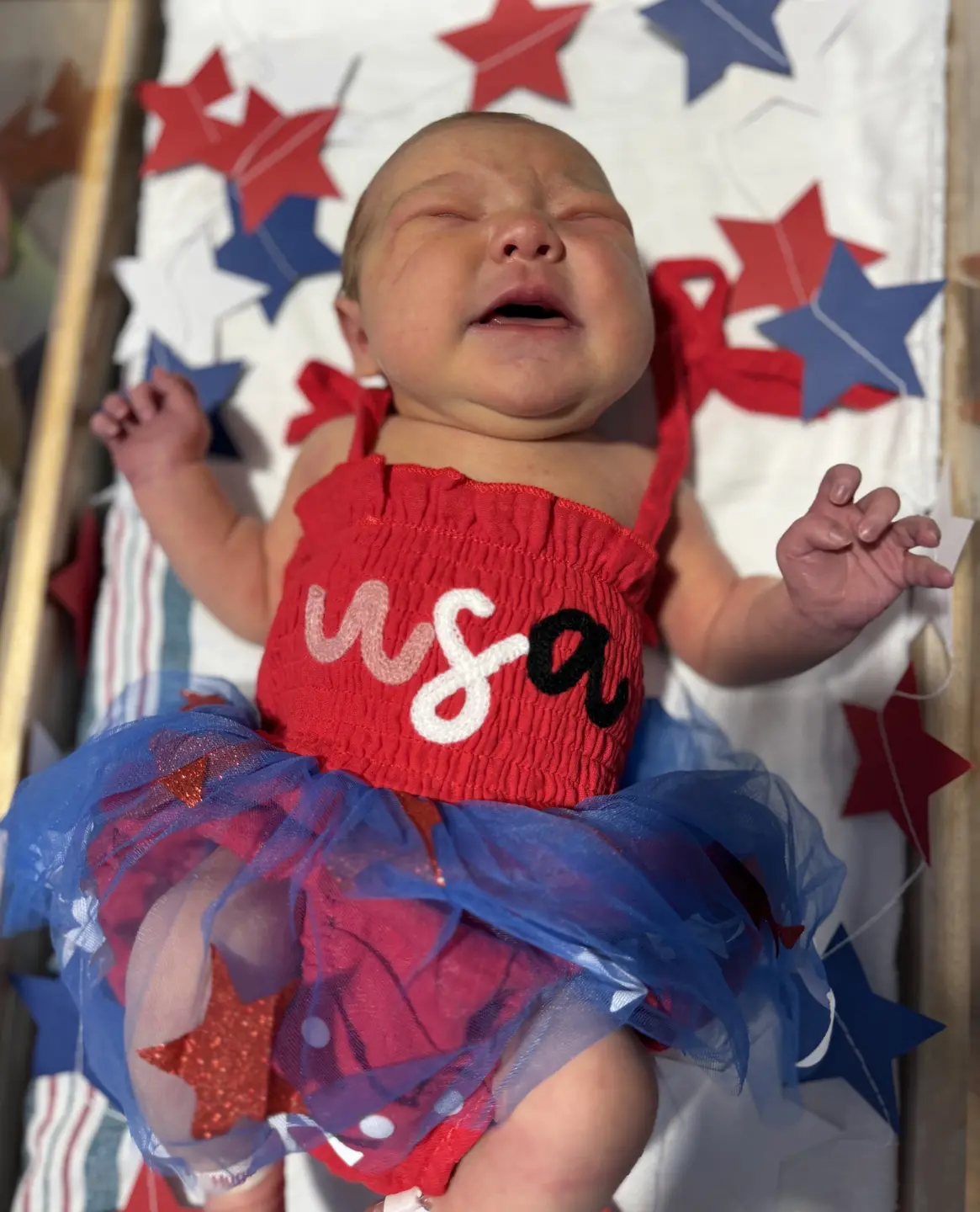 Newborns debuted in their red, white, and blue for the festive holiday