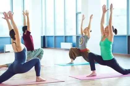 A group of people in a yoga studio.