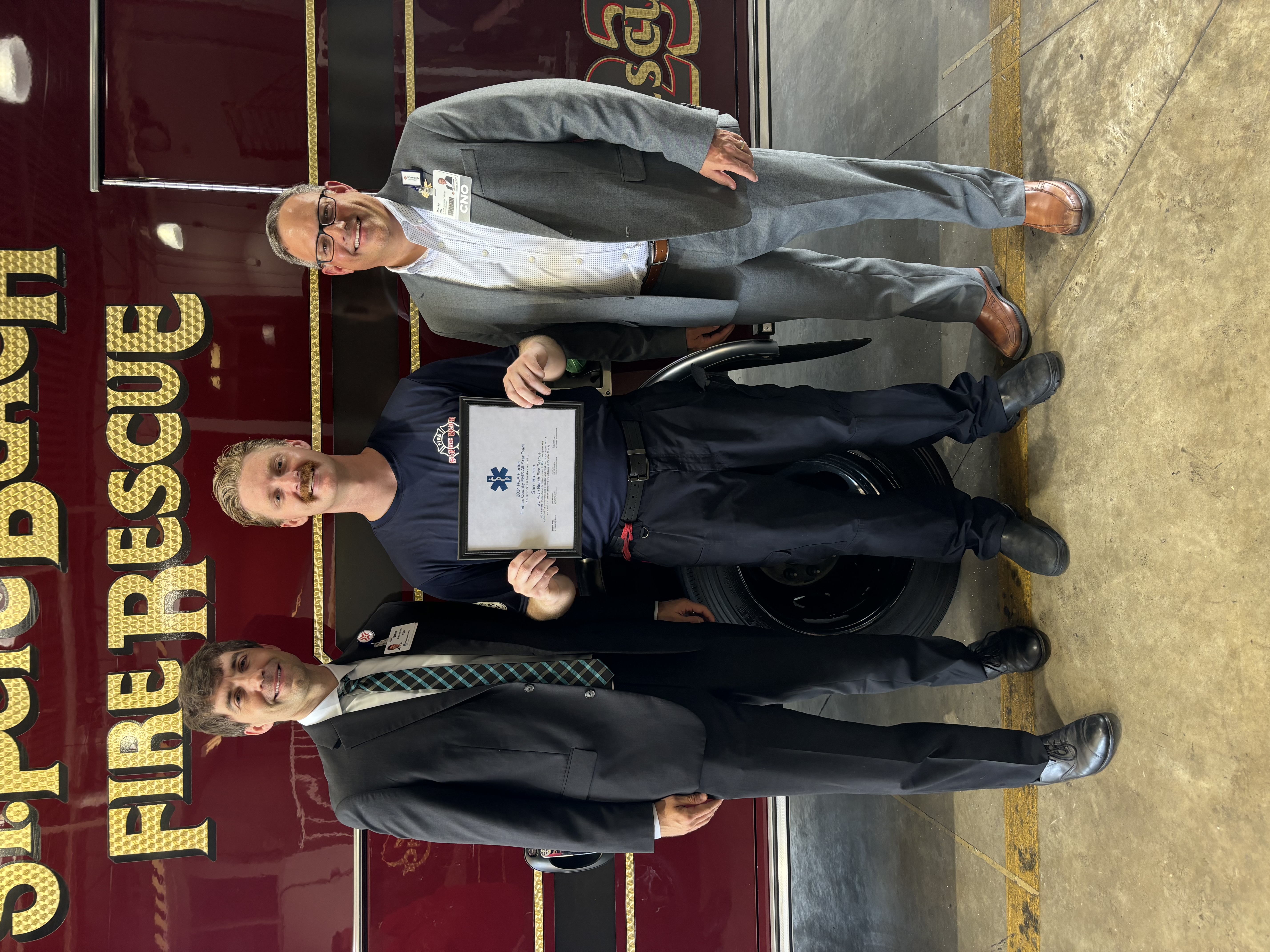 HCA Florida Pasadena's CEO and CNO pose with Sam Bathon.