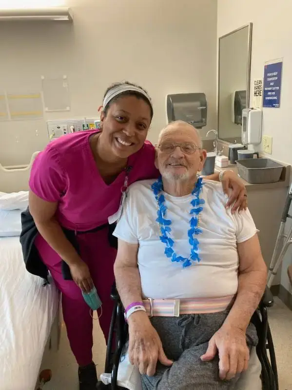 Pictured is Michael Holton with a rehabilitation colleague.